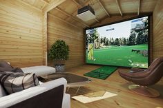 a living room with couches, chairs and a flat screen tv on the wall