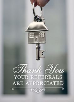 a hand holding a house key with the words thank you your referals are appreciated