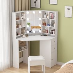 a white vanity table with lights on it