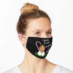 a woman wearing a black face mask with candy canes on it and the words, i