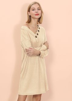 The Emes Shoptunic dress is detailed with soft knit like textures across the entire piece making it ideal to lounge in at home during fall and winter. Features a v neck line. decor buttons attached to one side of the v neck line trim. long sleeves. mid thigh length and a relaxed fit.MATERIAL:100% Soft CottonMEASUREMENTS: Product Length is 32"-34"in Small | Bust & Hem: 38"-40"in Medium | Bust & Hem: 40"-42"in Large | Bust & Hem: 42"-44"in XL | Bust & Hem: 44"-46"in Cream V-neck Sweater Dress For Fall, Fall Cream V-neck Sweater Dress, Casual Fall Tunic With Buttons, Elegant V-neck Tunic For Fall, Casual V-neck Tunic For Fall, Elegant Fall V-neck Tunic, Casual Beige Tunic For Fall, Beige Long Sleeve Fall Tunic, Casual Long Sleeve Sweater Dress With Buttons