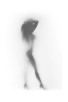 a blurry image of a woman walking in the snow