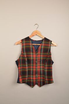 vintage check tartan waistcoat in great vintage condition without stains or holes. Size: Not available (see measurements) measurements: - Chest(armpit to armpit: 43m(16.2") - Length from the backside(Center bottom of the collar to center bottom of the garment): 42 37cm(14.5") - Shoulder to shoulder: 31cm(12.2") NOTE: Due to the age, clothing/items can shrink or it may be that the sizing from that time the item was made in, is not the same as the sizing in modern clothing and current sizes. Make Classic Plaid Sleeveless Vest, Classic Plaid Vest, Classic Sleeveless Plaid Vest, Fitted Plaid Sleeveless Vest, Fitted Sleeveless Plaid Vest, Oversized Waistcoat, Tartan Waistcoat, Thrift Wishlist, Clown Clothes