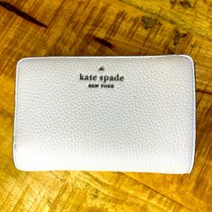 This Beautiful Kate Spade Wallet Is Compact But Holds It All. Doesn’t Look Like It’s Ever Been Used However There’s A Small Ink Mark On The Outside. It May Come Off But I Didn’t Want To Cause Any Damage To Your Wallet. Please See Pics Before Bidding. Kate Spade Bifold Coin Purse, Kate Spade Compact Wallet For Everyday, Kate Spade Compact Everyday Wallet, White Kate Spade Wallets As Gift, White Rfid Blocking Wallets For Everyday, White Rfid Blocking Wallets, White Kate Spade Wallet For Everyday Use, Kate Spade Everyday Bifold Bag, White Kate Spade Bags With Card Slots