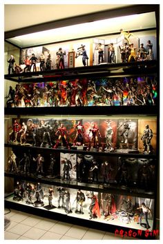 a display case filled with lots of action figures