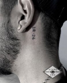 a man's neck with the word tattoo on it