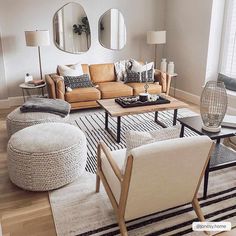 a living room filled with furniture and mirrors