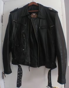 70's inspired 90's Harley Davidson leather jacket Total of 7 pockets, studded belt Conch detail on shoulders Harley Davidsons logo debossed on back Made in USA Good Condition, soft vintage leather Size XL Shoulders- 21 inches Armpit to armpit - 26 inches Waist - 23 inches Length - 26 1/2 inches Sleeve inseam - 19 inches Leather Jacket With Rivets For Biker Events, Retro Leather Biker Jacket With Pockets, Leather Outerwear With Rivets For Biker Events, Vintage Leather Jacket With Pockets For Biker Events, Harley Davidson Leather Jackets, Studded Leather Jacket, Harley Davidson Logo, Studded Belt, Swaggy Outfits