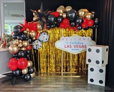 a welcome to las vegas party with balloons and streamers