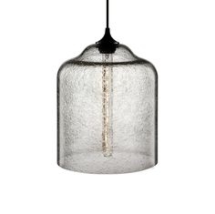 a glass light hanging from the ceiling