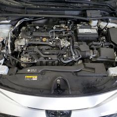 the engine compartment of a car with its hood open