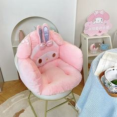 a child's chair with an animal shaped cushion