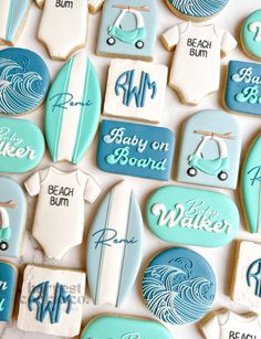 baby on board cookies are arranged in the shape of surfboards and surfers'names