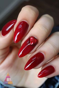 These deep red almond-shaped nails with a heart accent are both elegant and trendy. Ideal for a sophisticated fall look. Explore more classy nail ideas at NailHow.com and save this pin for your next nail inspiration! Nails With A Heart, Classy Nail Ideas, Red Almond, Classy Nail, Shaped Nails