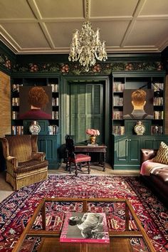 a living room filled with furniture and a chandelier