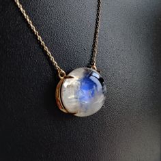 "ITEM DESCRIPTION: >>The pendant is made from Solid 14K Yellow Gold. Gemstone used is absolutely natural and ethically sourced. >>Natural Rainbow Moonstone in Cabochon round shape with a beautiful blue sheen in prong setting is studded on it with utmost precision. >>This is a minimalist design and is absolutely hassle-free and everyday jewelry. Gem: Rainbow Moonstone Gem size: 15x15mm round Gem weight: 11.80 carats Gold purity: 14K (58.33% approx.) Gold weight: 1.48 grams Gross weight: 3.84 gram Moonstone Pendant Necklace For Formal Occasions, Formal Moonstone Round Necklace, Formal Round Moonstone Necklace, Round Sapphire Cabochon Necklaces, Round Sapphire Cabochon Necklace, Unique Moonstone Round Necklace, Elegant Moonstone Gemstones Gift, Unique Round Moonstone Necklace, Gold Necklace Pendant