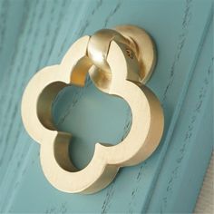 a close up of a door handle on a blue door