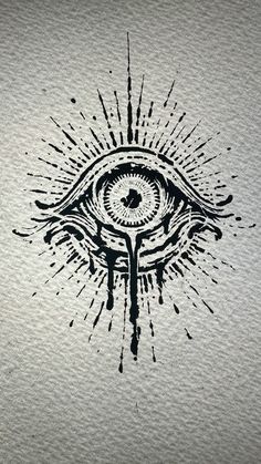 an eye drawn on paper with ink splatters