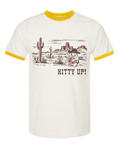 Let's go girls! Our instant classic Kitty Up design is ready for summer! This super cute retro style tee is made with soft cotton and features our famous cowboy cat. A must have for desert dwellers and city citizens alike! Unisex sized and printed on a cream color tee with yellow accent binding on the sleeves and neckline. Available in sizesXSSMLXLAdditional sizes available upon request. Funny Tee Shirts, Cream Yellow, Yellow Accents, Ringer Tee, Fashion Tees, Retro Style, Cream Color, Clothes For Sale, Womens Tees