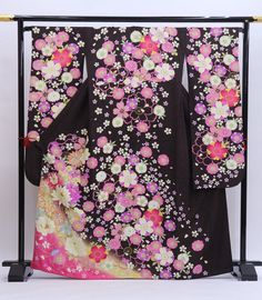 Cover yourself in flowers wearing this traditional Japanese silk Furisode kimono in black.    Made of high quality silk threads.  Beautiful on or as a room display too. Item: Furisode Silk Kimono No. frs177 Size: US  L   /  Length 64.5 inch (164cm), Width 27 inch (69cm). Design :  Floral Condition: Used, Very Good. Please check the photos. Need a Obi sash to wear this kimono? Find it here: https://www.etsy.com/shop/KimonoFujiyamarock?ref=simple-shop-header-name&listing_id=1418707729&section_id=1 Traditional Black Kimono With Floral Print, Traditional Black Floral Print Kimono, Traditional Black Kimono For Tea Ceremony, Kimono Mom, Kimono Girl, Furisode Kimono, Obi Sash, Wedding Kimono, Black Kimono