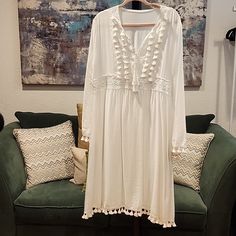 This Is A Listing Created For A Posh Show. Join A Posh Show To Learn More! Spring Beach Cover-up Dress With Tassels, V-neck Beach Cover-up Dress With Tassel Ties, V-neck Tassel Tie Beach Cover-up Dress, Long Sleeve Tassel Dress For Beach, Spring Day Out Dress With Tassels, Casual White Dresses With Tassel Ties, Casual White Dress With Tassel Ties, Casual White Dress With Tassels, Casual White Tassel Dress