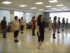 a group of people standing in a large room