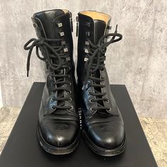 2019 Chanel Black Calfskin Leather Cc Combat Lace Up Tie Tall Boots Used With Box No Dust Bags Luxury Calf Leather Cap Toe Boots, Luxury Patent Leather Boots, Luxury Black Patent Leather Boots, Luxury Black Cap Toe Boots, Luxury Silver Leather Boots, Designer Black Boots With Medium Fit, Designer Calf Leather Boots, Designer Black Boots Medium Fit, Designer Black Calf Leather Boots