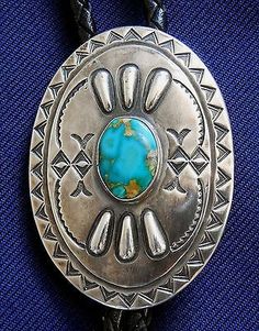 This Sterling Silver Native American Bolo has intricate hand stamping, repoussée work, and an oval cabochon of natural turquoise. Tie Men, Native American Turquoise