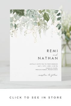 a wedding card with greenery on it