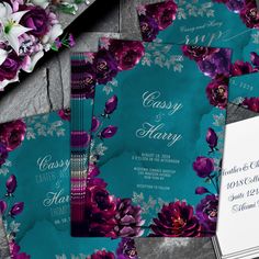 wedding stationery with purple flowers on teal background