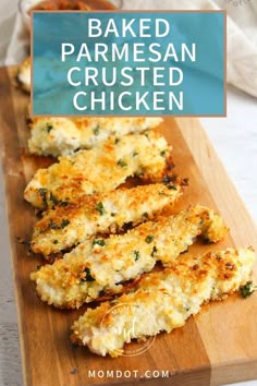 baked parmesan crusted chicken on a wooden cutting board with text overlay