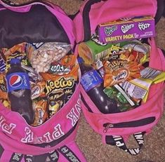 two pink backpacks filled with snacks and drinks