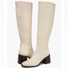 A Flared Block Heel And Blunt Square Toe Add A Hint Of Signature Style To An Essential Knee-High Boot Shaped From Smooth Leather. Sam Edelman "Wade" Square Toe Boots New. Size 6.5 Ivory Leather The Most Perfect Winter White Knee High Smooth Leather Upper Blunt Square Toe Retro Style Partial Inside Zipper Closure Flared Block Heel Leather & Synthetic Material 2.75" Heel Height 16.25" Shaft Height 15.75" Opening Circumference These Are New However Were Stored With A Large Pallet Of Shoes And There White Leather Knee-high Boots Medium Width, White Leather Wide Calf Knee-high Boots, White Leather Knee-high Boots With Wide Calf, White Leather Knee-high Boots With Reinforced Heel, Cream Boots With Leather Sole And Round Toe, White Leather Knee-high Boots With Round Toe, Beige Pointed Toe Boots With Leather Sole, White Knee-high Boots With Reinforced Heel, Beige Almond Toe Boots With Leather Sole