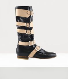 Our Pirate boots were first revealed in the Autumn-Winter 1981 'Pirate' collection, which was influenced by Vivienne's interest in adventurous pirate stories from the 17th and 18th centuries. The design captures the essence of romanticism and rebellion often linked to pirates, with soft, slouchy leather and oversized buckles that give the boots a rugged, distressed appearance. Vivienne Westwood Pirate, Vivienne Westwood Fashion, Blue Ankle Boots, Pirate Boots, Mens Designer Shoes, Black Shoes Women, Black Boots Women, Boots Outfit, Lace Boots