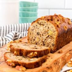 a loaf of banana nut bread on a cutting board