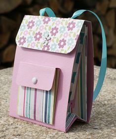 a small pink bag sitting on top of a table