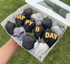 a box filled with chocolate covered strawberries and the words happy b day