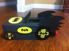 a cardboard box that has been made to look like a batman car