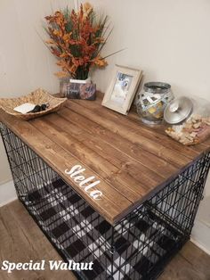 a wooden table with metal wire baskets and flowers on top, along with other items