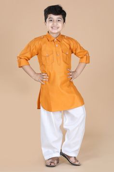 Superior in finishing. This boys pathani suit comprises kurta & salwar.The boys ethnic wear features an banded collar and beautiful button design, pocket on chest and roll up sleeve. Made from cotton fabric. This kids cloths have soft texture and the fit is regular for boys. Orange Cotton Sets For Diwali, Orange Cotton Long Sleeve Kurta, Long Sleeve Orange Cotton Kurta, Casual Yellow Sets For Eid, Orange Long Sleeve Sets For Festivals, Casual Yellow Sets For Festive Occasion, Kurta Pajama For Boys, Pathani Suit, Kids Kurta Pajama