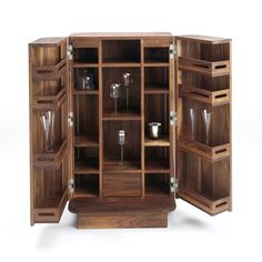 an open wooden cabinet with wine glasses and cups in it's doors, on a white background