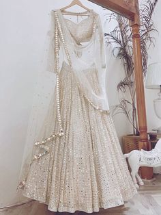 <ul>
<li style="text-align: justify;"><span data-preserver-spaces="true">Let your elegance reflect and get compliments with this beauty. This white lehenga is made of georgette material beautified with sequins work, and thread embroidered.</span></li>
<li style="text-align: justify;"><span data-preserver-spaces="true">This lehenga comes with a similar color georgette material blouse designed with sequins work, and thread embroidery, and a similar color n White Lehenga Choli, Sequence Lehenga, Gold Lehenga, Ghaghra Choli, Paper Border, Lehenga Choli For Women, Choli For Women, White Lehenga, Sabyasachi Lehenga