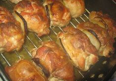 chicken wrapped in bacon is cooking on the grill