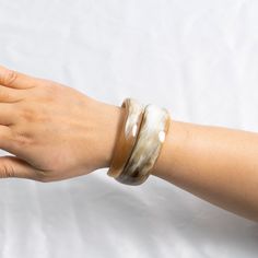 Material: Buffalo horn.  Height of Each Bangle ~ 3.6 cm, Diameter of each Bangle ~ 6.5 cm Elegant Snake Shape Bangle Gift, Adjustable Snake Bangle Gift, White Hand-strung Bangle Jewelry, Adjustable Snake-shaped Bangle For Gifts, Snake Bangle, Snake Bracelet, Bracelets For Women, Horn, You Nailed It