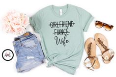 This girlfriend fiance wife shirt makes a great honeymoon t shirt for someone just married or the future mrs.  All shirts are made with high quality heat transfer vinyl and are applied with a commercial grade heat press (NOT an iron) in a smoke-free, pet-free home.  We carry various colors and sizes Unisex XS through 4XL. Additional colors can be made to order.  If you prefer Women's sizes or a different style shirt (tank top, long sleeves, etc.) please contact us. Please refer to our sizing cha Gifts Girlfriend, Newly Wed, Tank Top Long, Gift For Bride, Future Mrs, New Wife, Style Shirt, Just Married, Transfer Vinyl