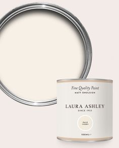 a white paint can with the words,'fine quality paint'in silver on it