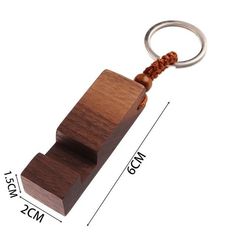 a wooden keychain with a rope attached to it and measurements for the length