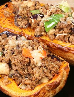 two stuffed sweet potatoes with meat and vegetables