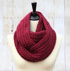 THE HENSLEY This chunky infinity scarf style is called the Hensley. It is hand-crocheted with a ribbed stitch, giving it a beautiful, striped texture! This maroon infinity scarf pops with bright color! COLOR: The scarf color shown is Cranberry, a classic shade of maroon - perfect for fall! To order your scarf in a different color, please select the color you prefer in the drop-down menu when ordering; the color chart is available in the last picture. MATERIAL: This scarf is made of thick, high quality 100% acrylic yarn. Does not feel scratchy against the skin, it is very soft and luxurious. Perfect for those chilly months! SIZE: This style has plenty of length to double-loop around your neck! CARE: This hand-made Infinity Scarf should be hand-washed in cold water, and always lay flat to dr Maroon Scarf, Chunky Crochet Scarf, Shades Of Maroon, Chunky Infinity Scarves, Burgundy Scarf, Scarf Chunky, Scarf Style, Red Scarf, Stripes Texture