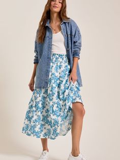 Blend comfort and style with this classic relaxed style midi featuring a smocked waistline to ensure a perfect fit, while the tiered design adds movement. Casual Flowy Tiered Skirt, Flowy Tiered Casual Skirt, Casual Tiered Bottoms For Brunch, Spring Day Out Tiered Skirt, Tiered Skirt For Spring Day Out, Tiered Flowy Skirt For Day Out, Casual Tiered Maxi Skirt For Brunch, Casual Midi Skirt With Ruffle Hem, Casual Ruffled Midi Skirt